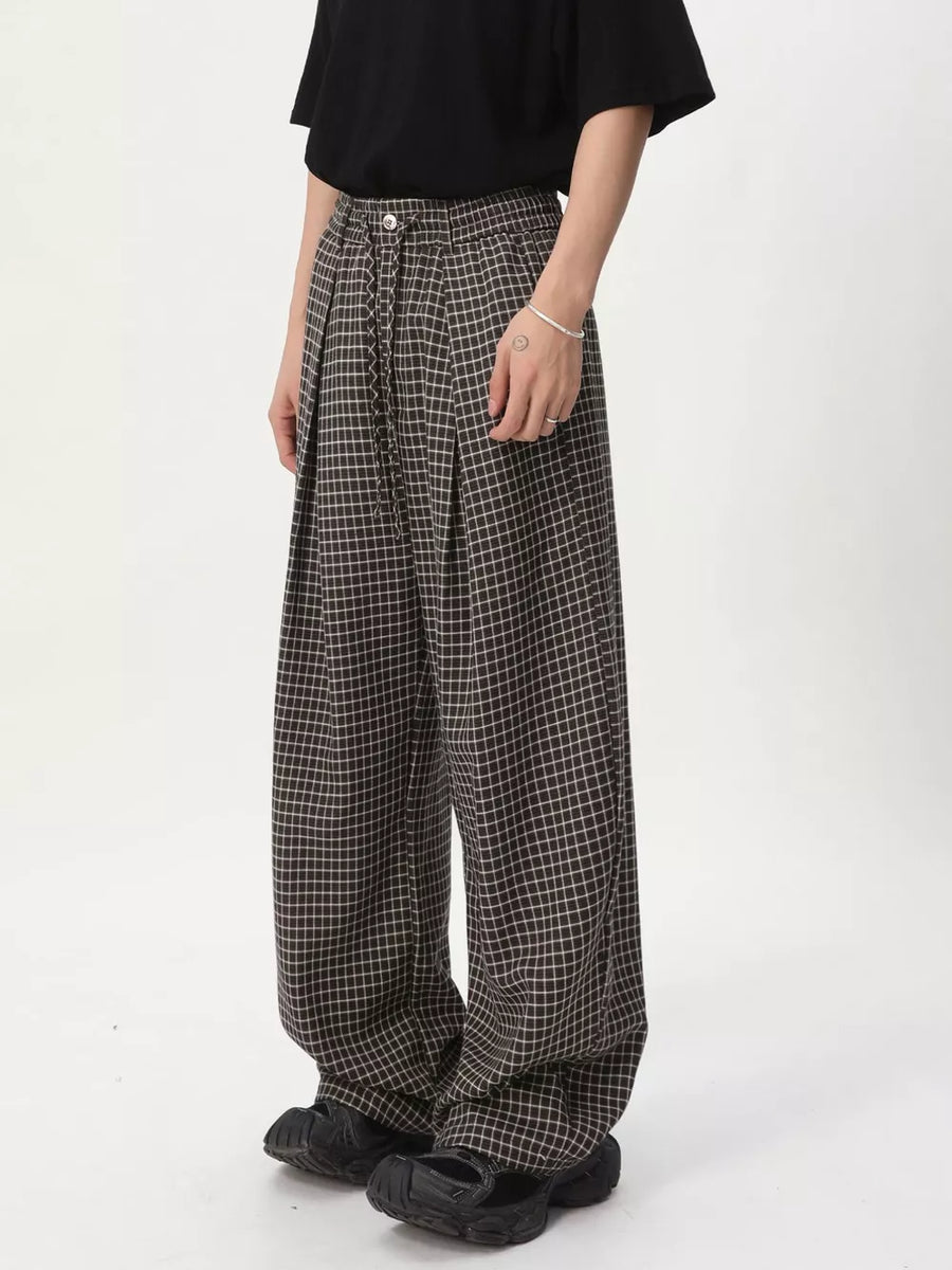 Plaid wide-leg joggers with adjustable drawstring waist and relaxed fit.