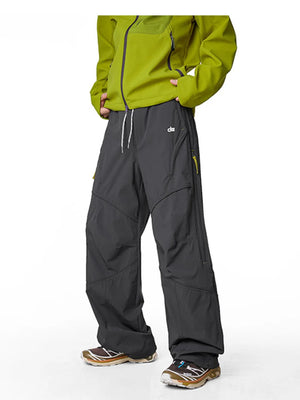 Graphite gray relaxed fit cargo active pants with drawstring and zippered pockets.