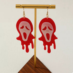 red earrings with graphic and N/A