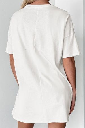White cotton tee dress with short sleeves and a relaxed fit.