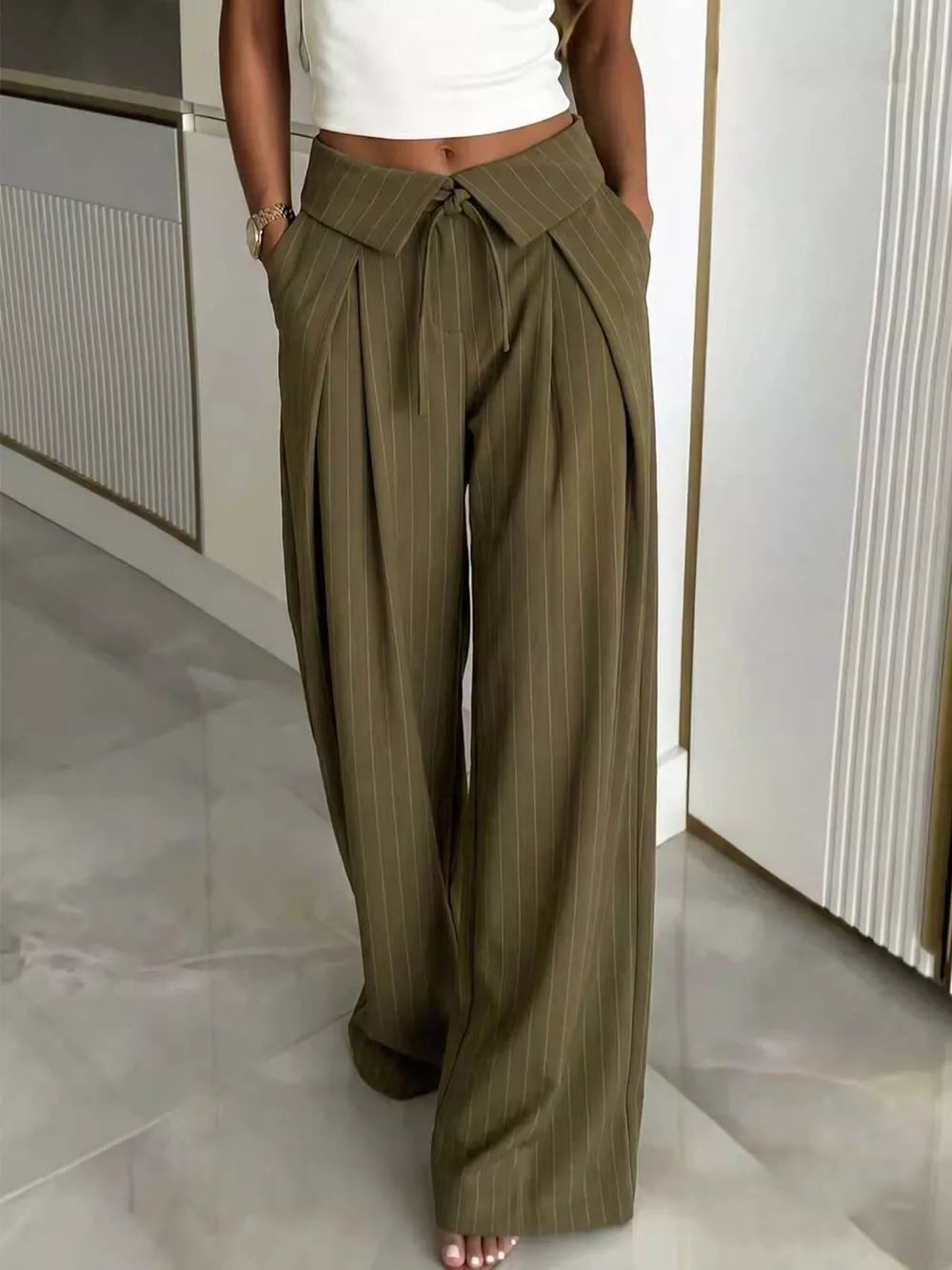 wide-leg pants in olive green featuring pocketed and wide-leg fit