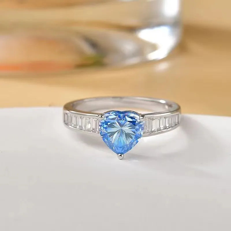 Silver ring with heart-cut aquamarine and baguette accents