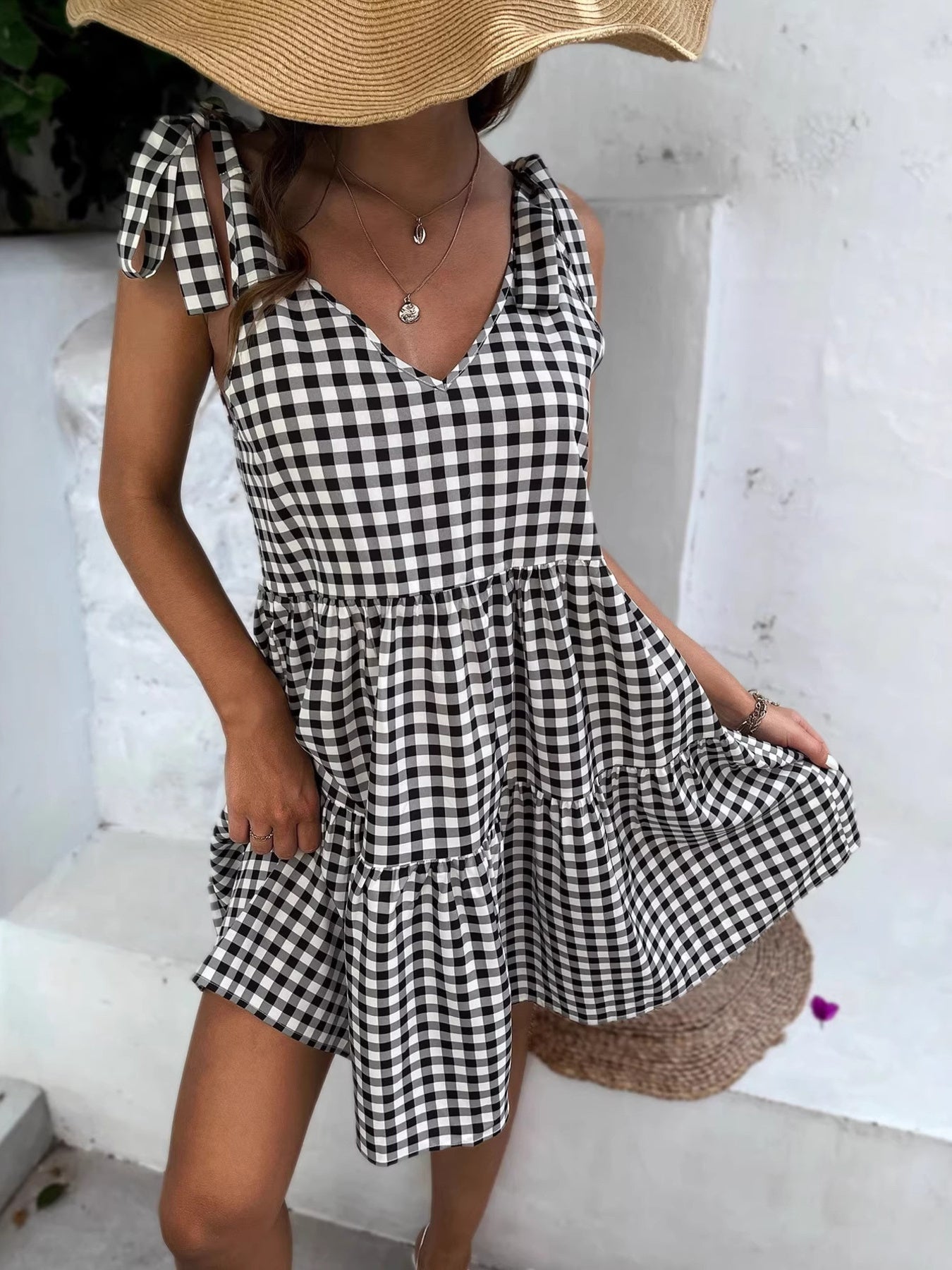 Black and white gingham tie-shoulder mini dress with tiered skirt