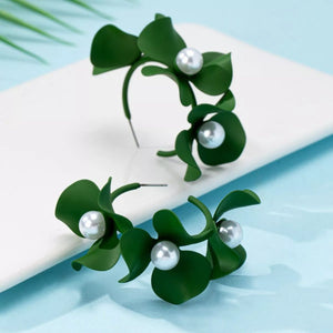 Green floral pearl hoop earrings with pearl accents.