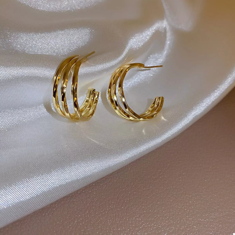 Elegant gold hoop earrings with twisted design, 18K gold plated alloy