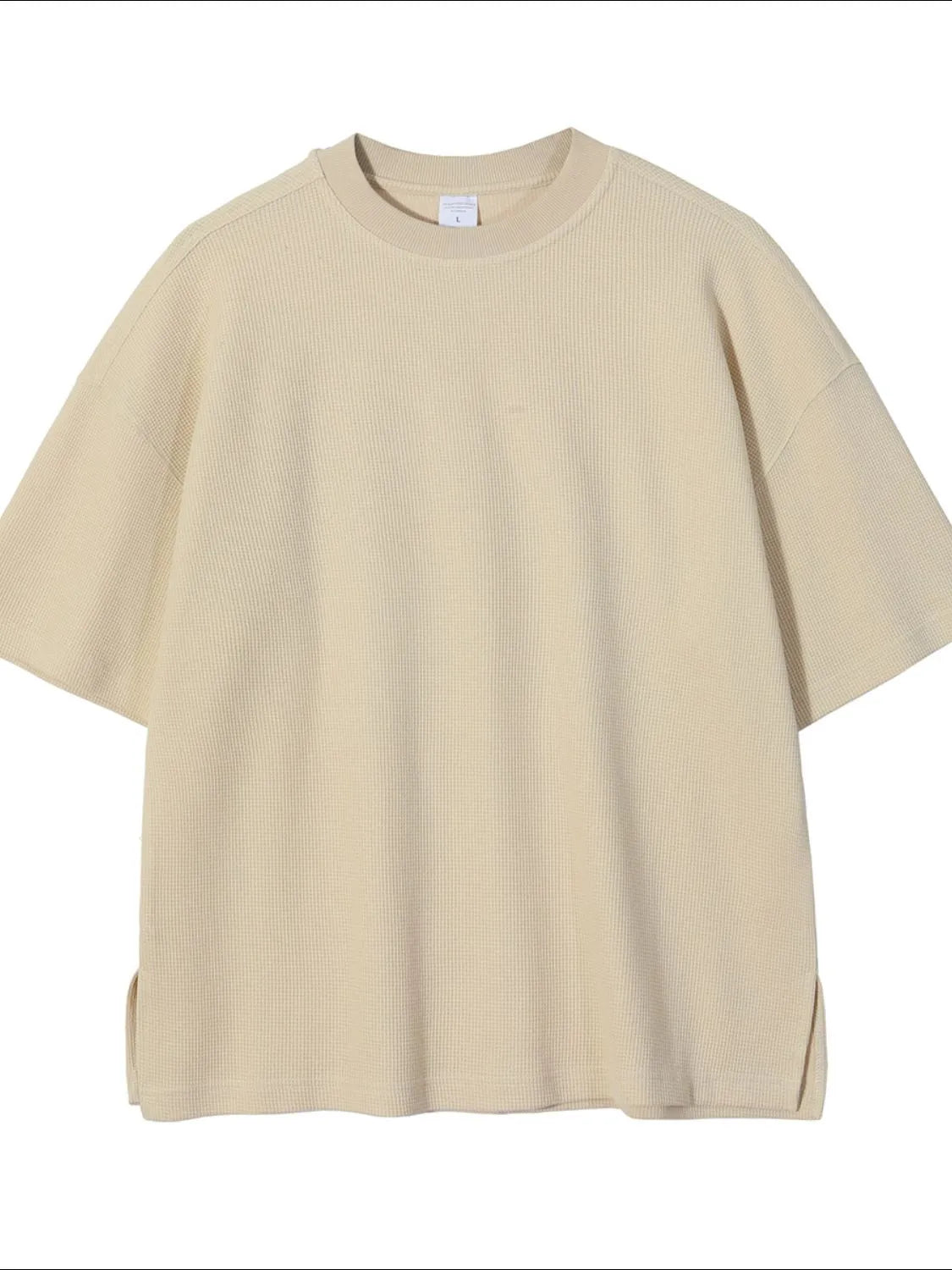 Beige waffle knit boxy t-shirt with crew neck and short sleeves.