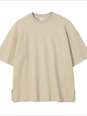 Beige waffle knit boxy t-shirt with crew neck and short sleeves.
