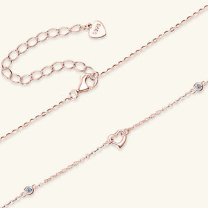 Rose gold linked heart pendant necklace with crystal accents and 925 stamp.