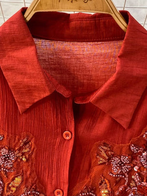 Red embroidered floral two-piece set with collared neckline and button front.