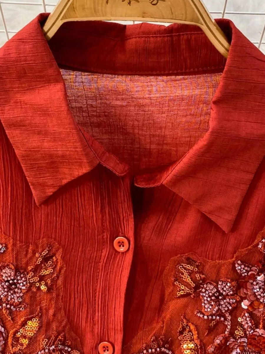 Red embroidered floral two-piece set with collared neckline and button front.