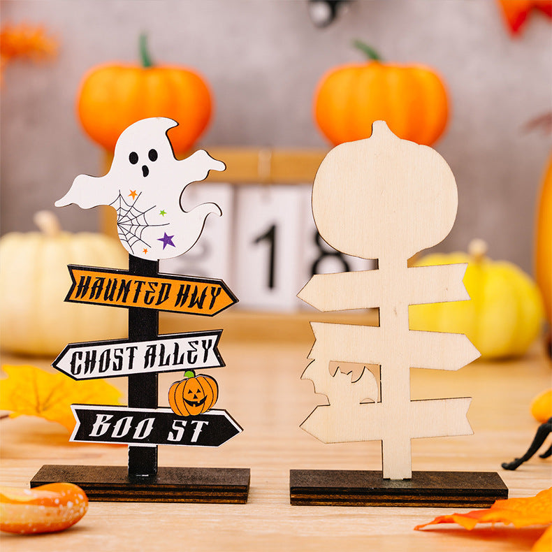 Halloween directional signposts with ghost and pumpkin, one unfinished wood.