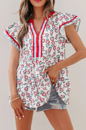 Vibrant floral cotton blouse with ruffle sleeves and a V-neck featuring red and blue stripes.