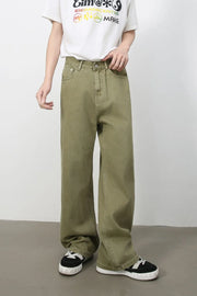 Wide-leg rigid denim trousers in yellow-green with a relaxed fit.
