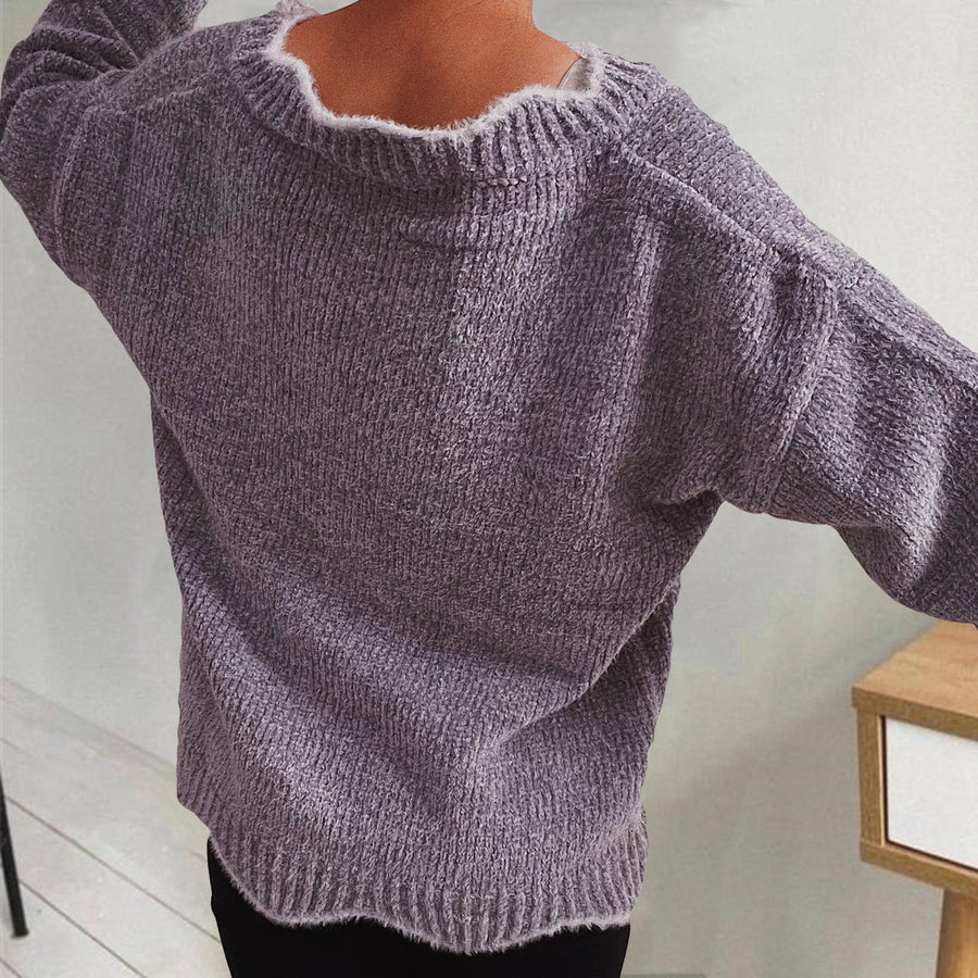 Lavender knit sweater with scalloped trim and ribbed texture.