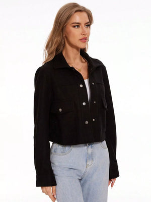 Black trucker jacket with snap buttons and chest pockets.