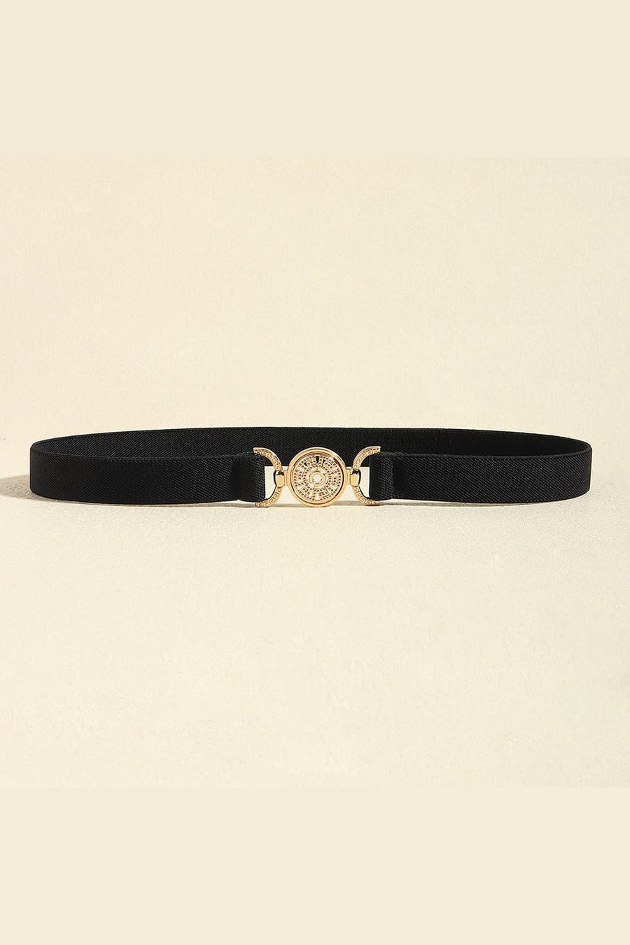 Black elasticated belt with a gold medallion buckle and alloy details
