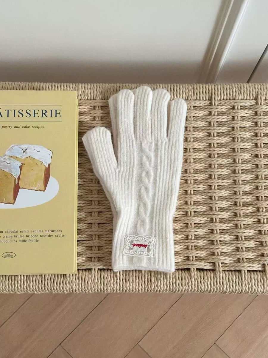 White acrylic cable knit gloves with embroidered detail