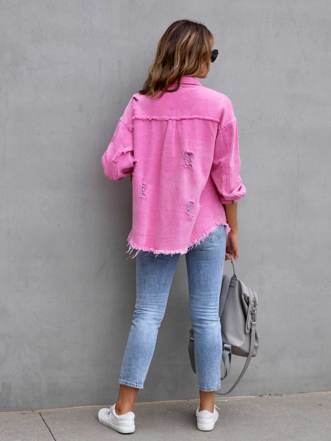 Fuchsia distressed denim shacket with frayed hem and cuffs.