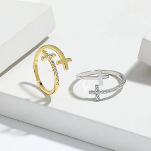 Gold and silver open rings with cross charms and crystal accents