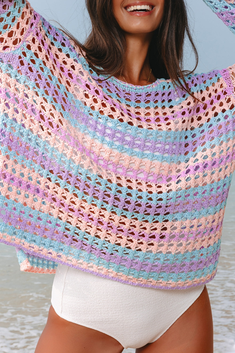 Pastel striped crochet beach cover-up with open knit pattern and relaxed fit.