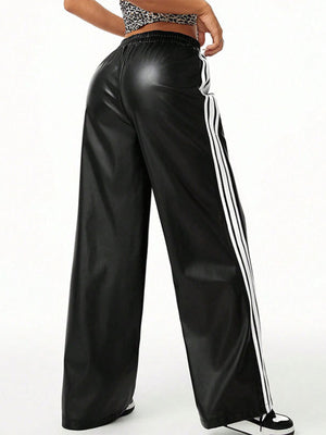 Black faux leather wide leg track pants with white side stripes and elastic waistband.