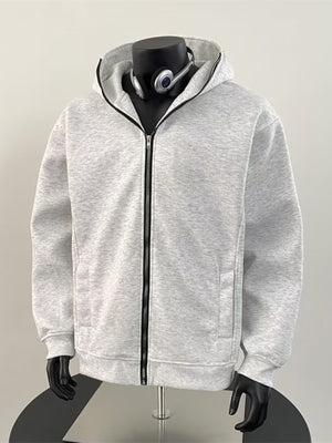 Light grey zip-up hoodie with pockets and long sleeves