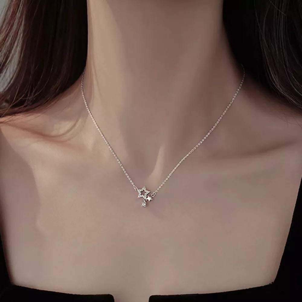Silver necklace featuring zircon accents and star