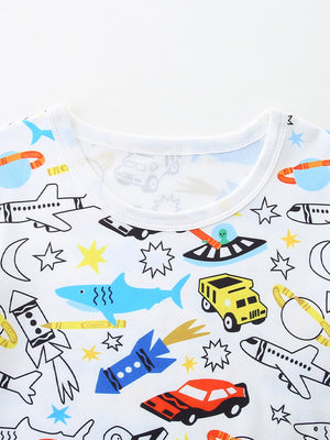Toddler underwear with a white background and a whimsical print of vehicles, rockets, aliens, and sharks.