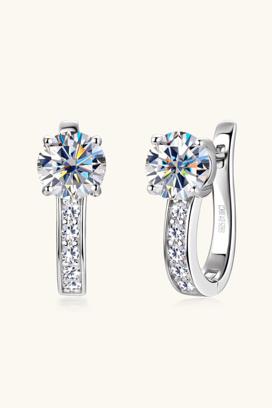 Silver pavé and solitaire hoop earrings with clear cubic zirconia stones.