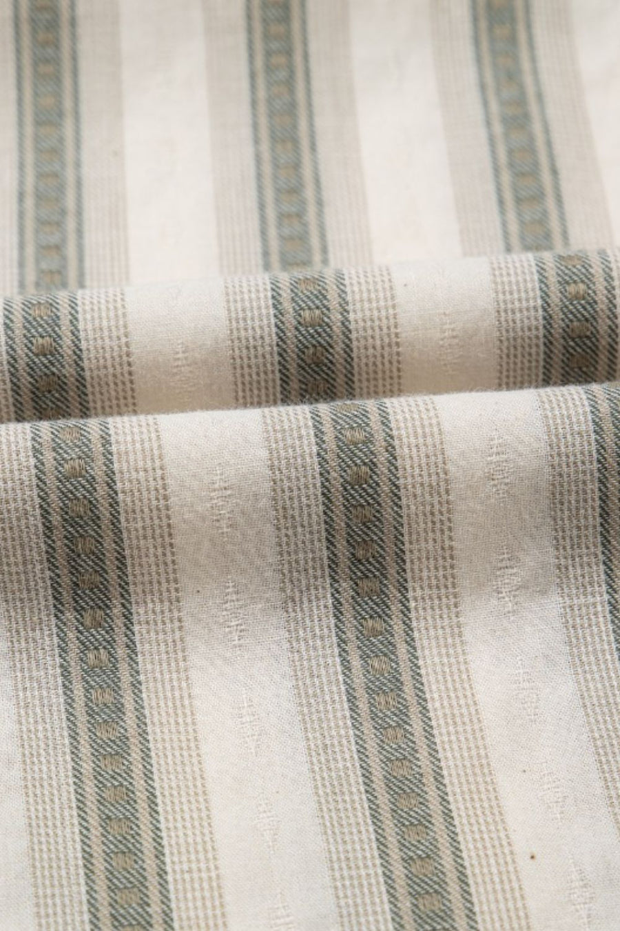 Striped linen blouse fabric with gathered sleeve texture detail