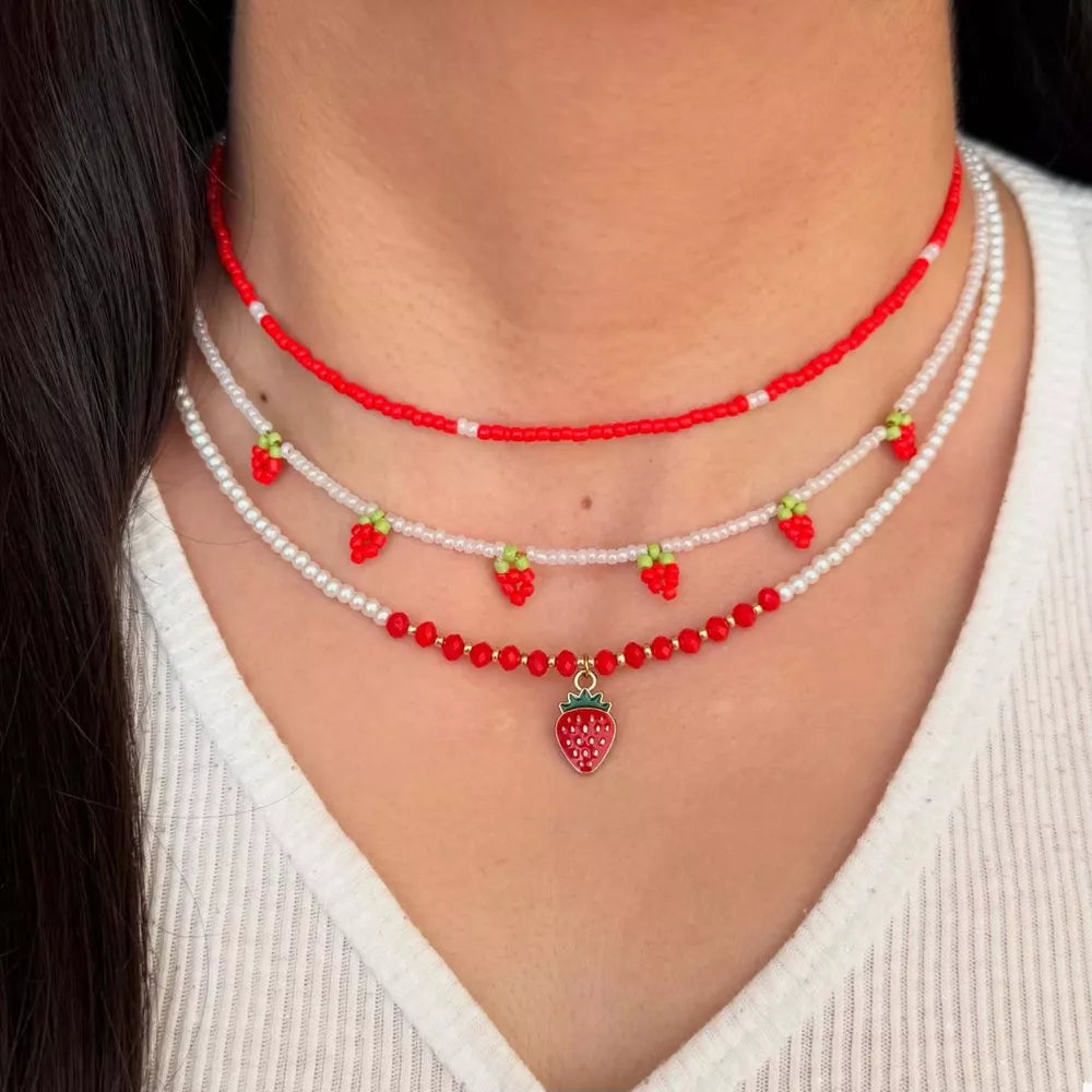 necklace in red featuring beaded and layered fit