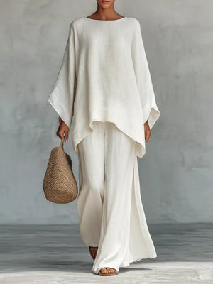White polyester two-piece set with flowing top and wide-leg pants