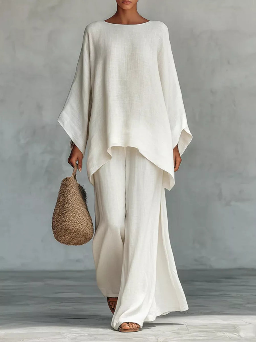 White polyester two-piece set with flowing top and wide-leg pants