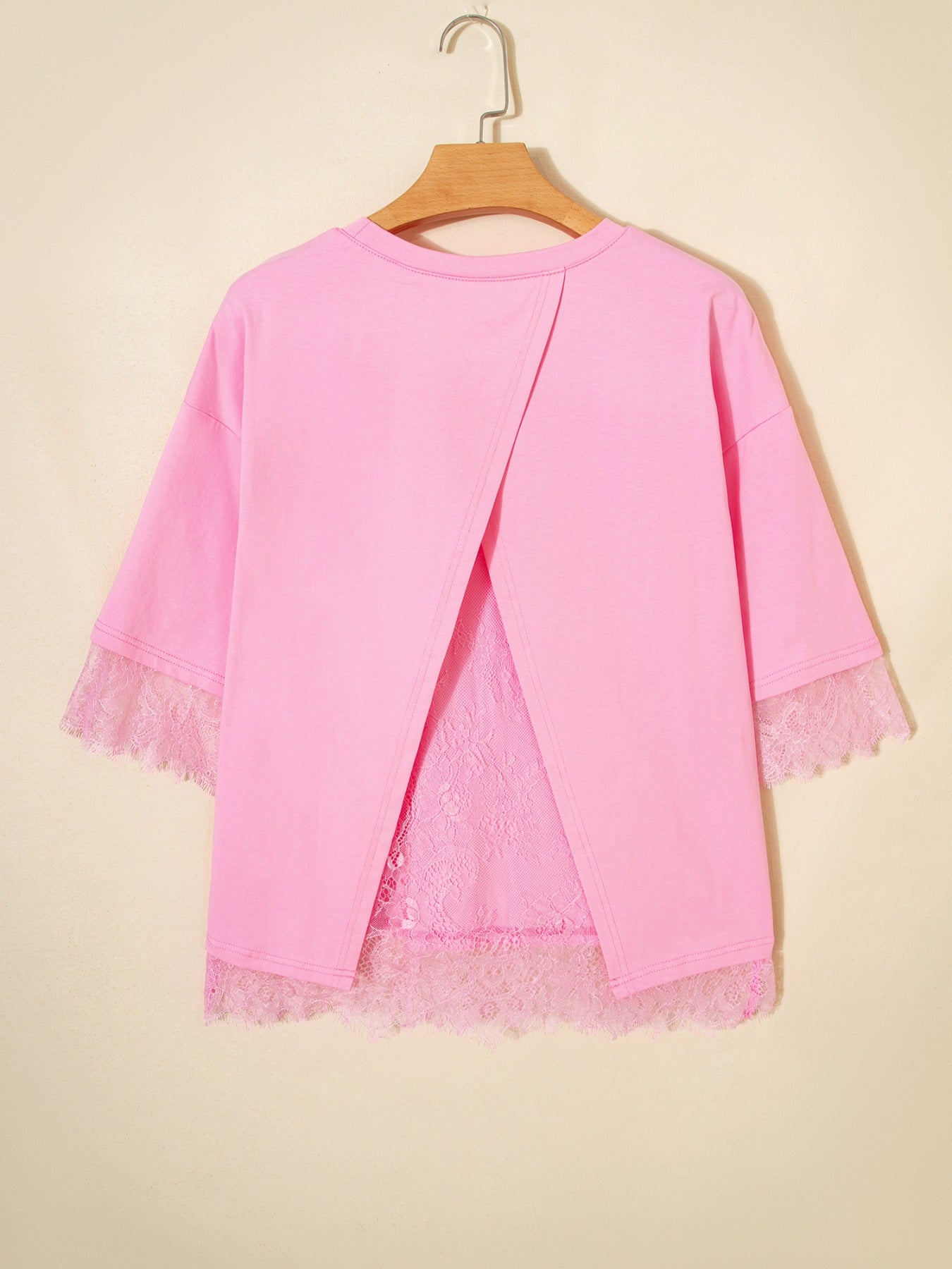 Pink cotton blend oversized tee with lace trim and open back detail.