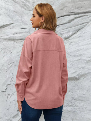 Pinkish corduroy button-up overshirt with a relaxed fit and button cuffs.