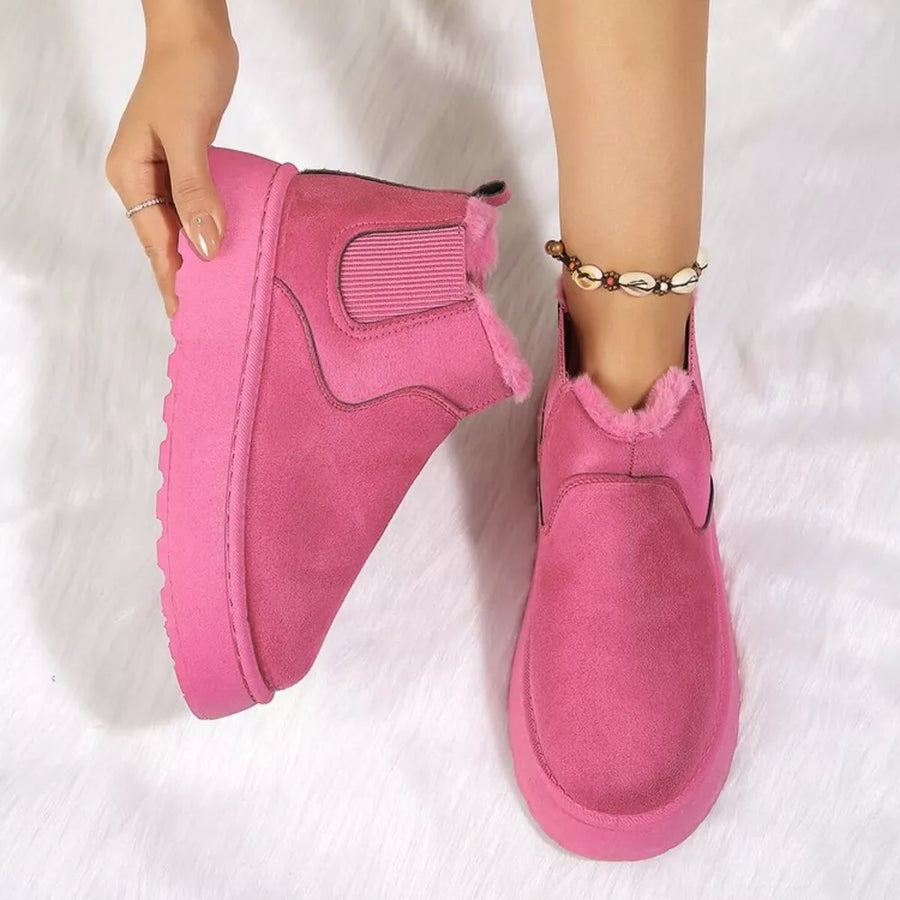 Hot Pink suede round toe platform ankle boots with faux fur lining.