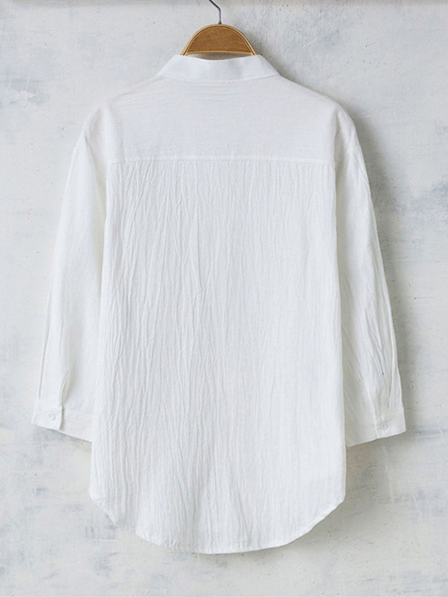 Men's white casual button-up shirt with band collar and textured fabric