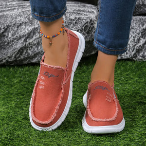 Deep Red canvas slip-on shoes with raw edges and embroidery detail.