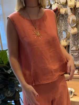 Apricot relaxed fit tank top and wide-leg pants set with crew neck and sleeveless design.
