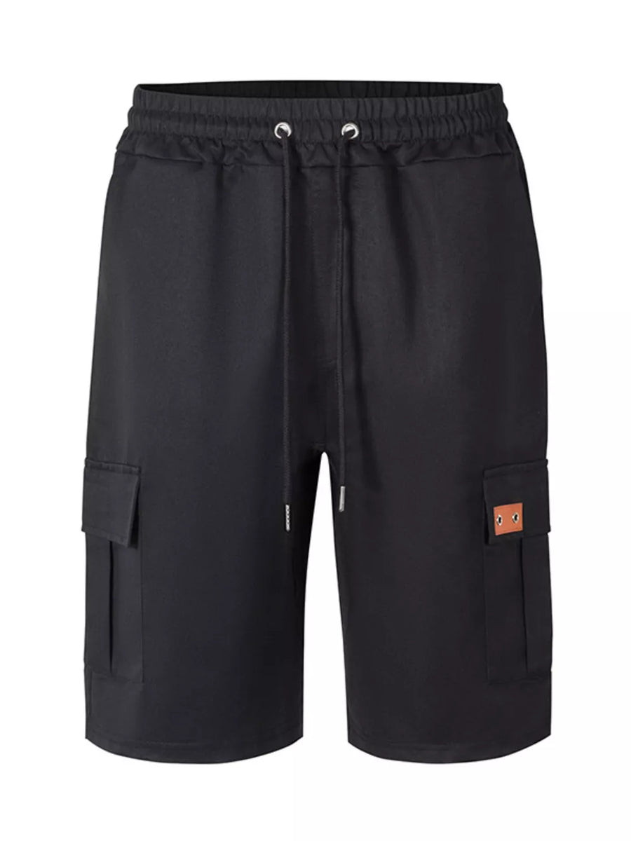 Black cargo shorts with elastic waistband, drawstring, and dual cargo pockets with a faux leather patch.