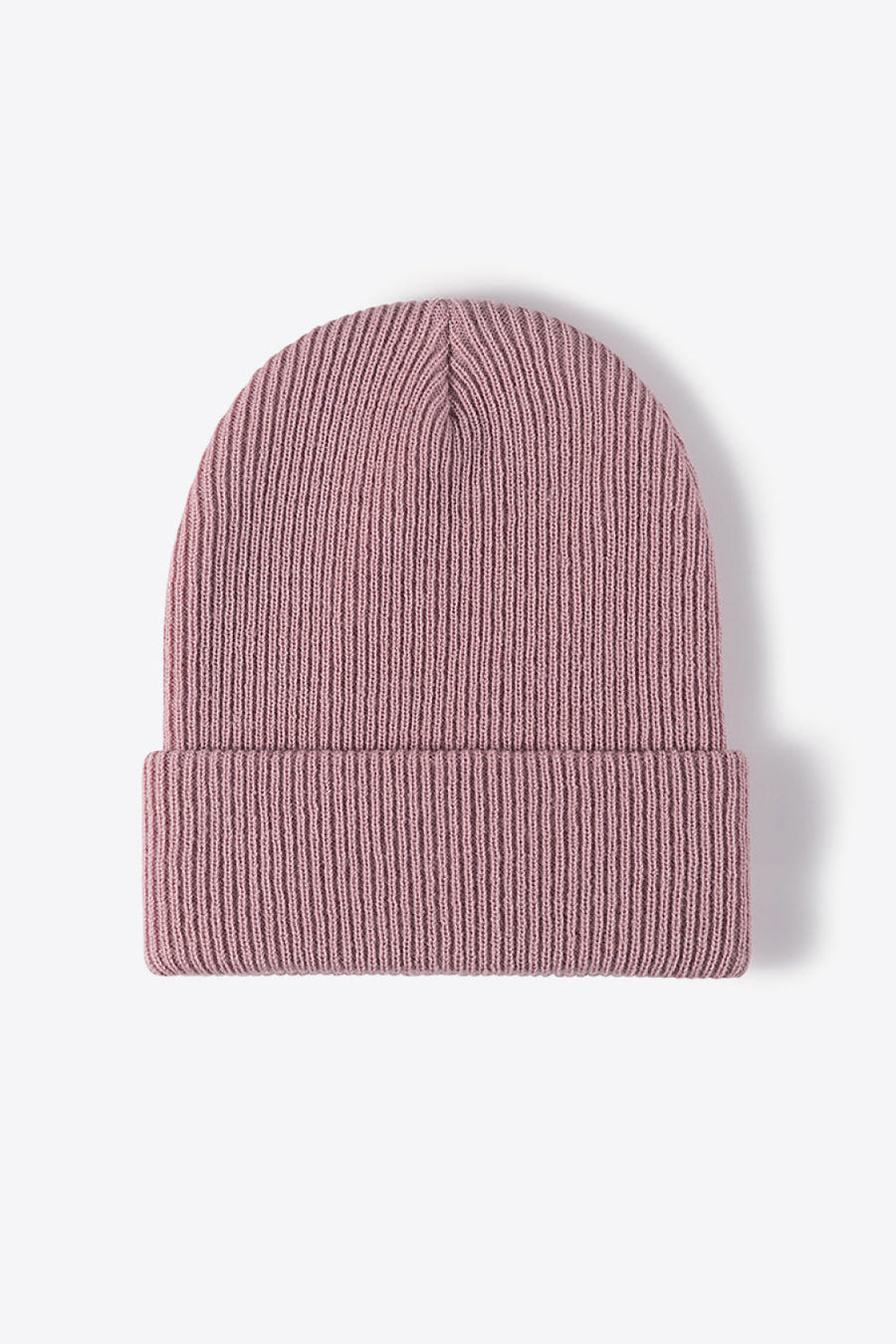 Pink ribbed knit beanie with a cuffed brim.