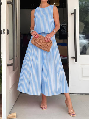 Sky blue striped buttoned two-piece set with pockets, sleeveless crop top and wide-leg pants.