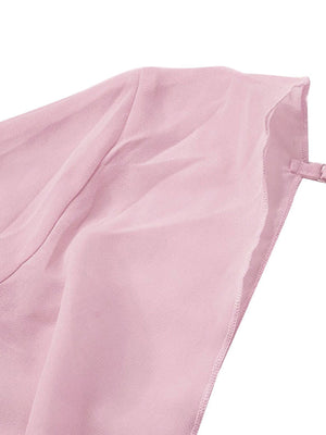 Pink chiffon mini dress with draped detail and adjustable strap.
