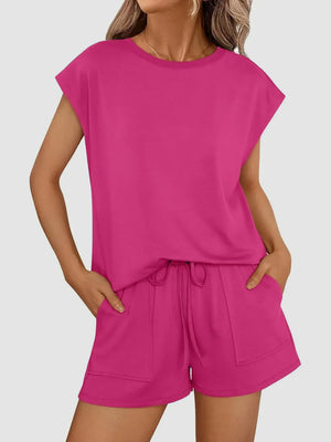Hot pink relaxed fit drawstring short set with cap sleeves and patch pockets.