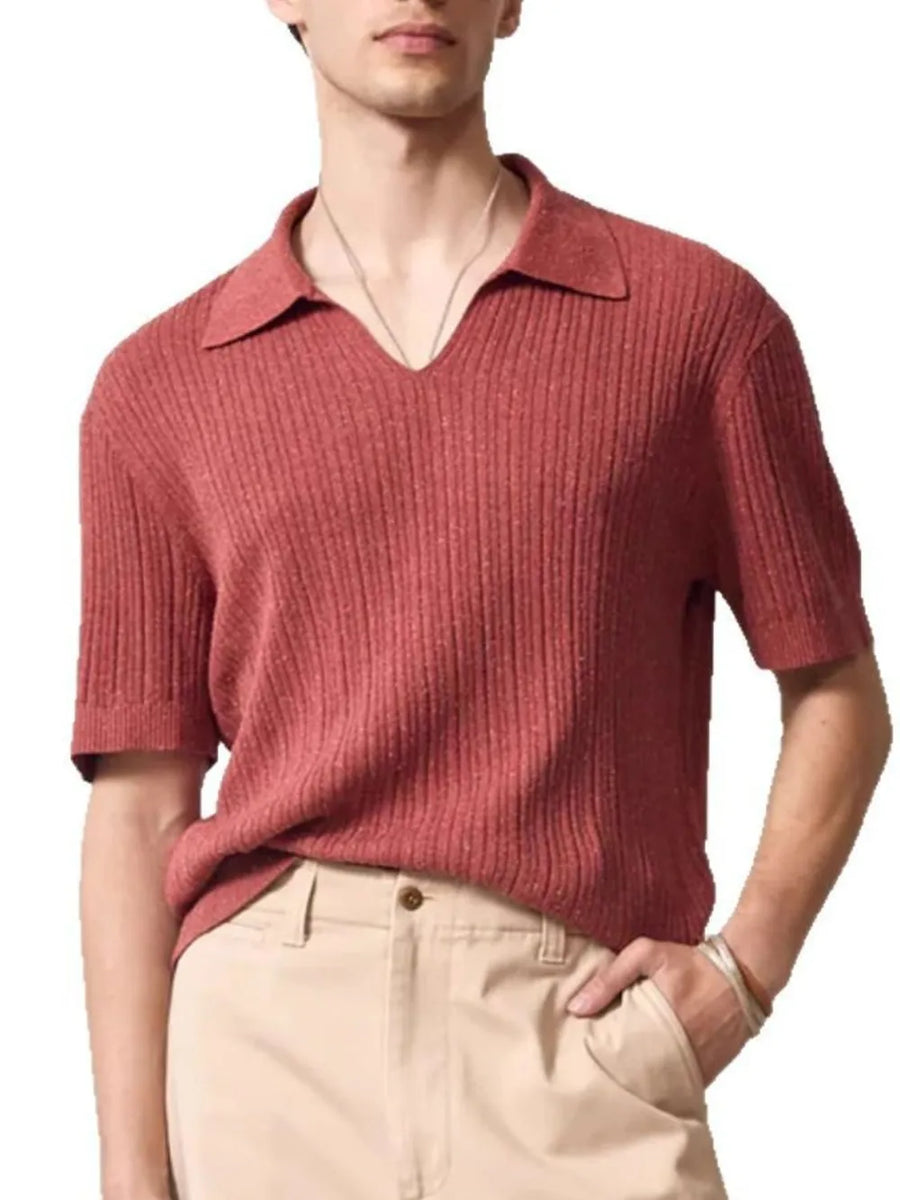 Textured ribbed knit polo shirt in orange-red with Johnny collar and short sleeves.