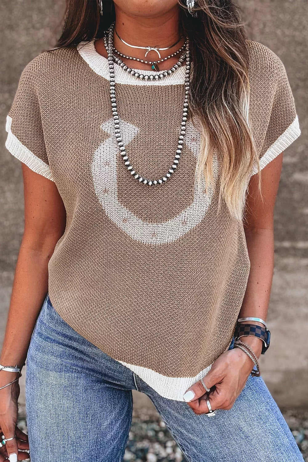 tan pullover sweater with graphic and crew neck