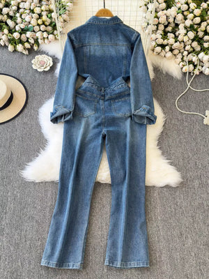 Chic buttoned denim jumpsuit with pockets, long sleeves, and flared legs.
