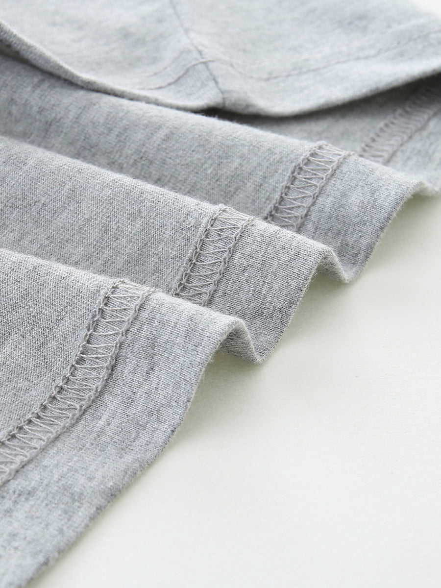Grey cotton t-shirt detail showing hem stitching
