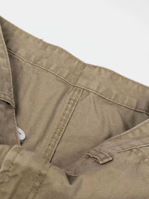 Khaki cargo pants with visible stitching and button closure detail.