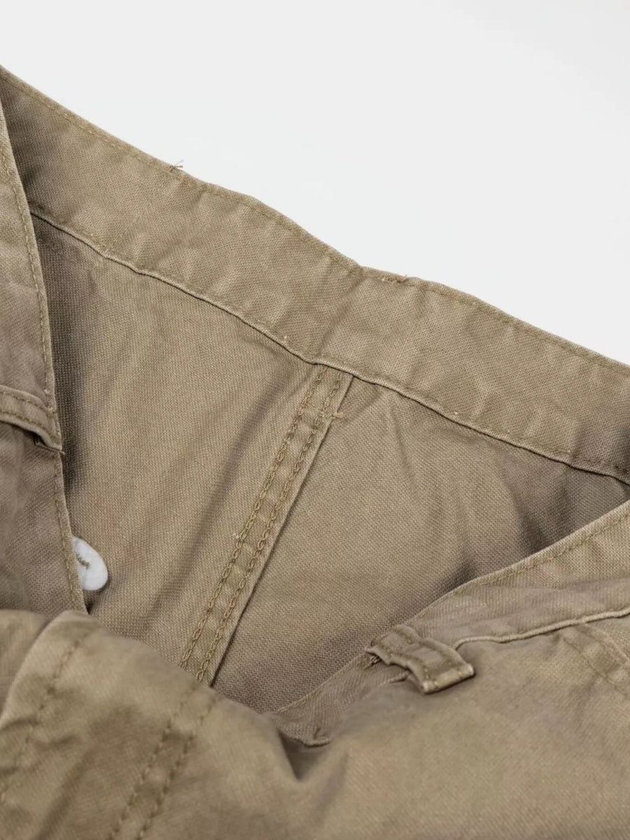 Khaki cargo pants with visible stitching and button closure detail.